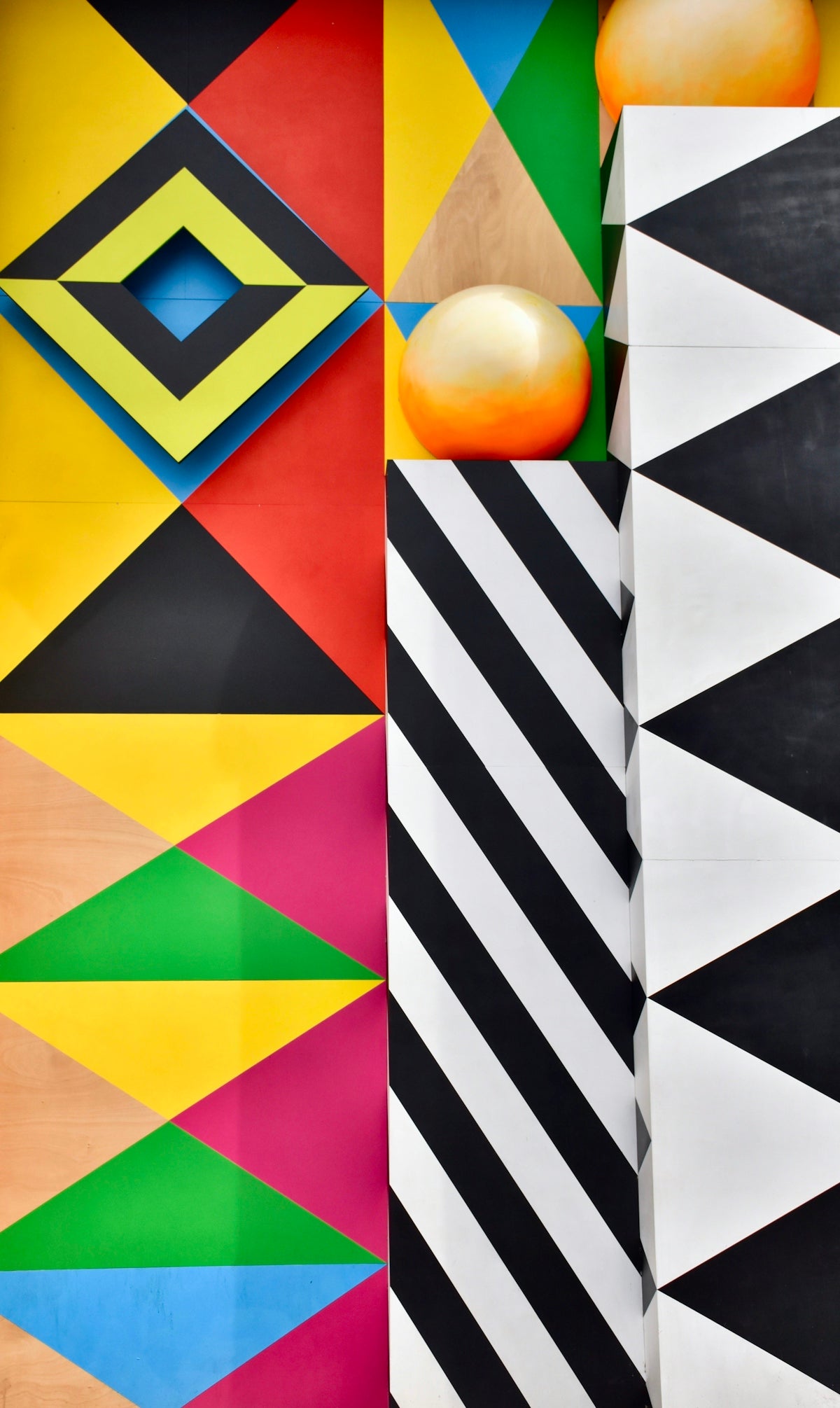 a wall with a lot of different colored designs on it