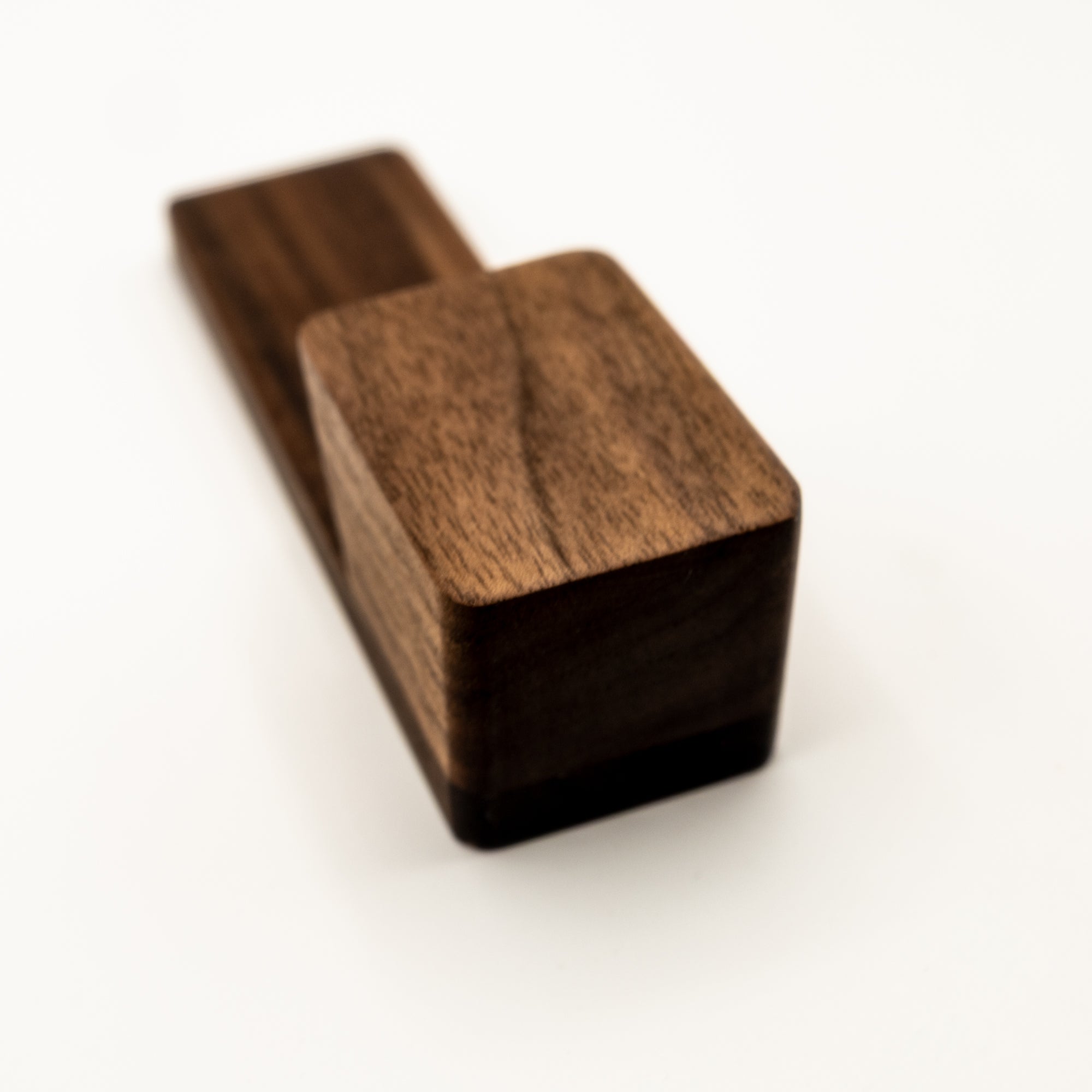 Walnut coat hook showcasing the wood grain